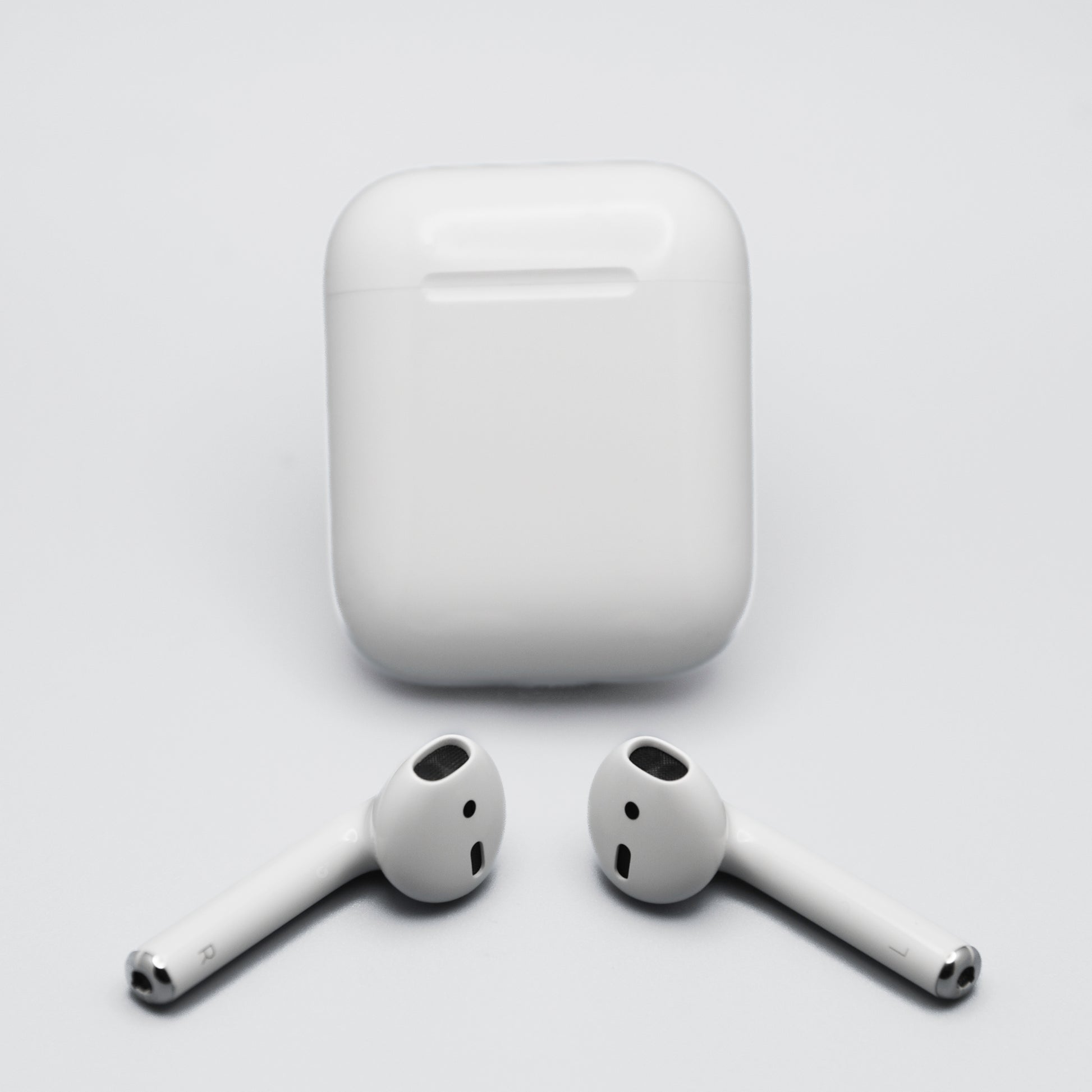 Apple AirPods 1st Gen AirPods with the AirPods shown out of the case