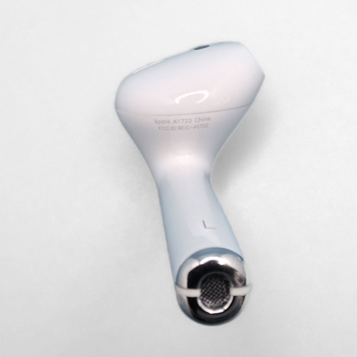Apple AirPod 1st Generation photo of model number A1722 on left AirPod 